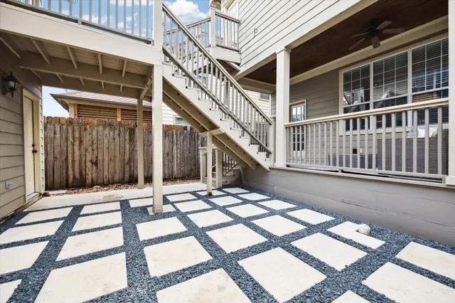 a view of a house with wooden deck