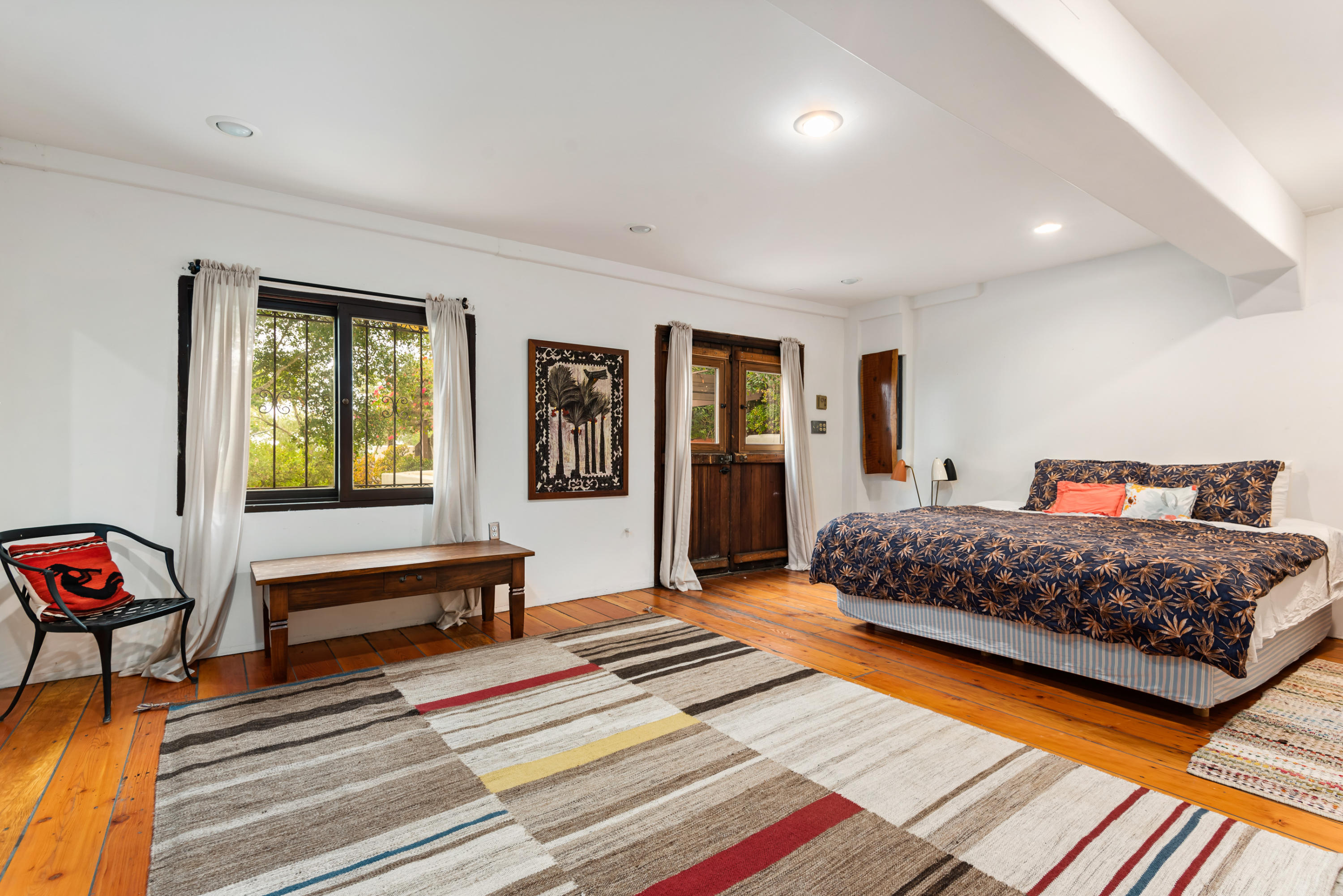 2217 Mission Ridge Road Santa Barbara, CA 93103 - Photo 36 of 57 a bedroom with natural light and wooden floor