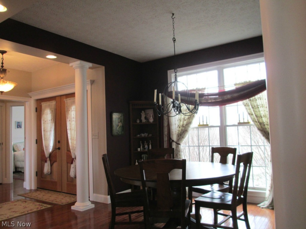 3429 Plymouth Ridge Road Kingsville, OH 44048 - Photo 7 of 25 Formal and elegant dining area adorned with natural sunlight and open to the great room - ideal for entertaining!