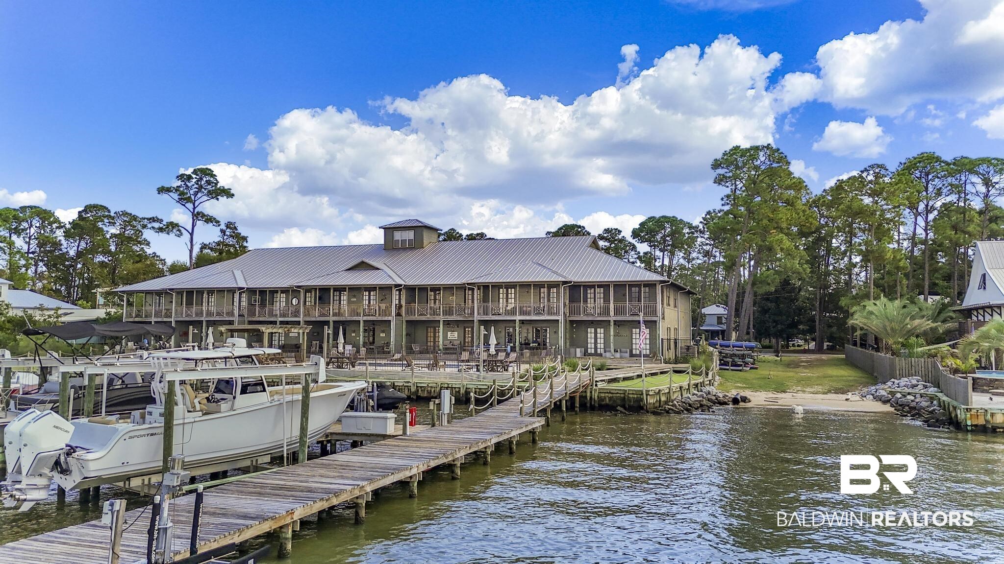 25773 Canal Road Orange Beach, AL 36561 - Photo 23 of 32 Dock with a water view and boat lift