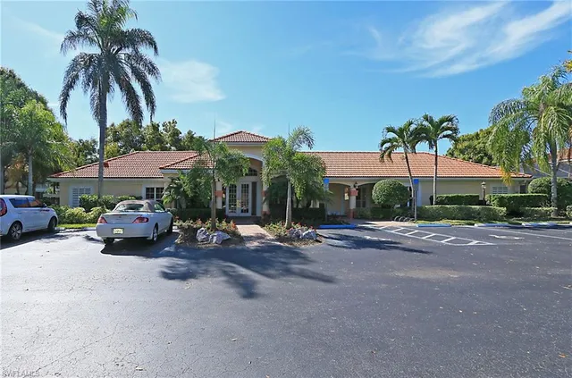 an aerial view of residential houses with outdoor space and river view