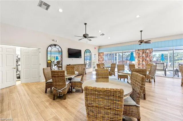 a view of a livingroom with furniture window and wooden floor