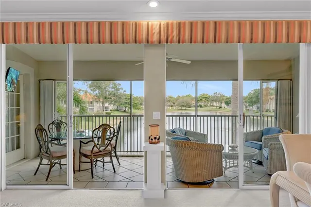 a view of a chairs and table in patio