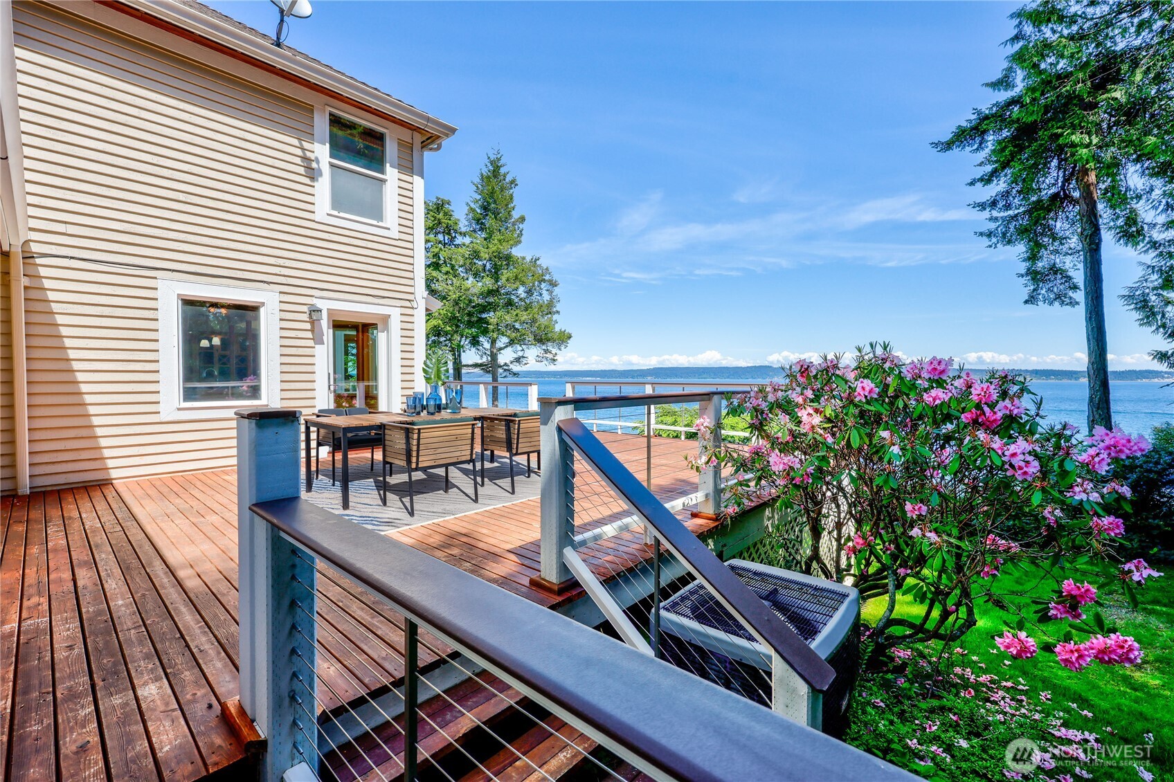 252 Jansen Road Nordland, WA 98358 - Photo 29 of 40 a balcony with wooden floor and outdoor seating