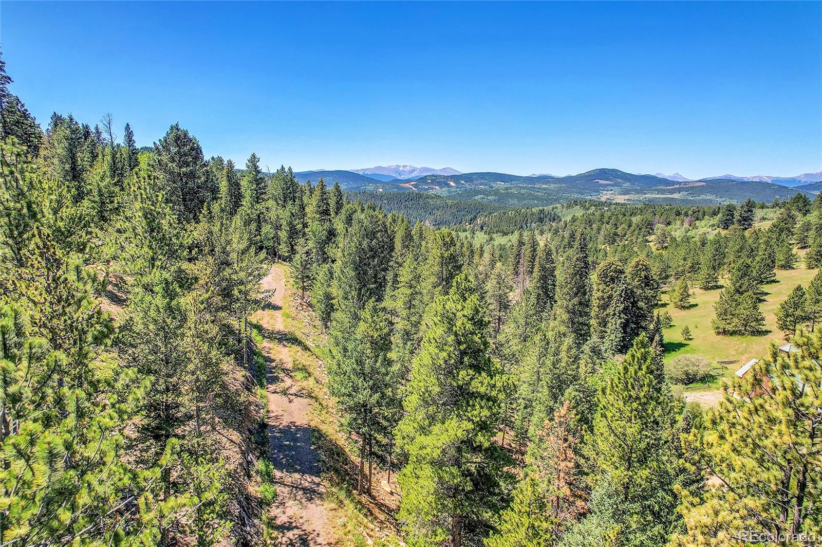 5 Hughesville Road Black Hawk, CO 80422 - Photo 8 of 17 a view of a city with lush green forest