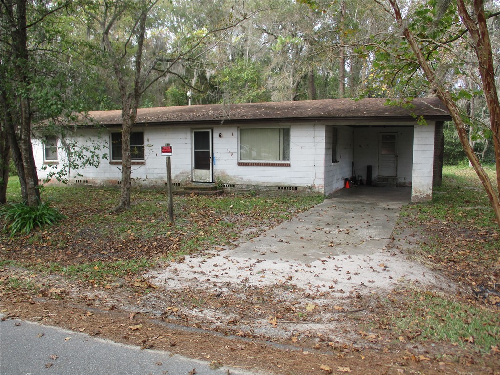 45029 Roberts Road Callahan, FL 32011 - Photo 6 of 9 a backyard of a house with seating space