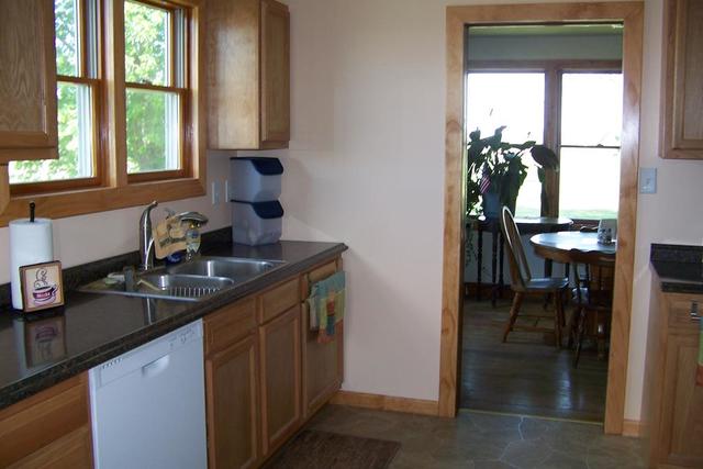 4265 North 3350 E Road Chatsworth, IL 60921 - Photo 4 of 22 a kitchen with a sink cabinets and a window