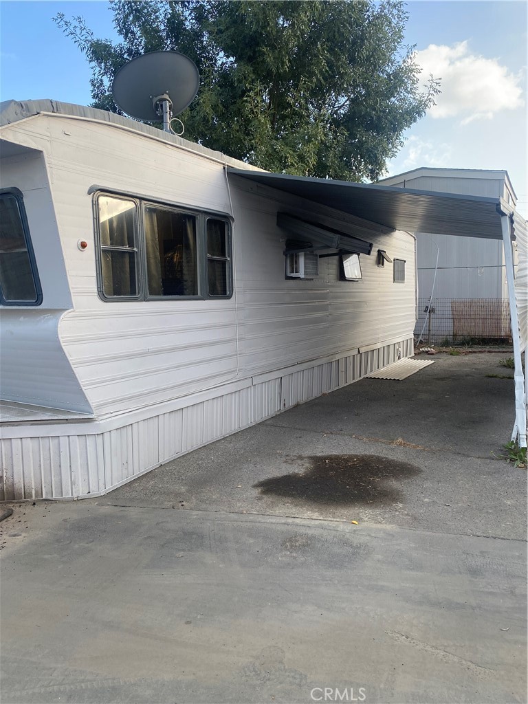 4849 Peck Road, Unit 37 El Monte, CA 91732 - Photo 3 of 10 Full vehicle parking space to the right side.