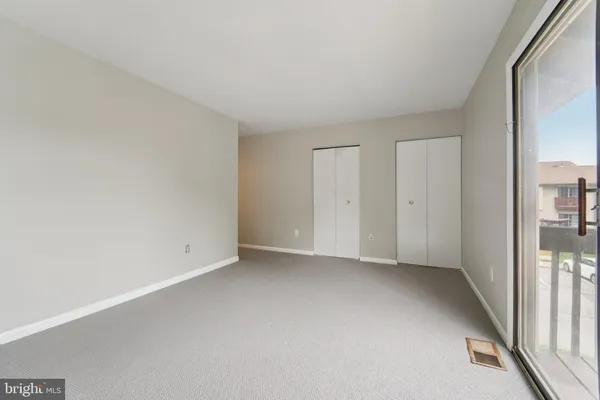 a view of an empty room and entrance