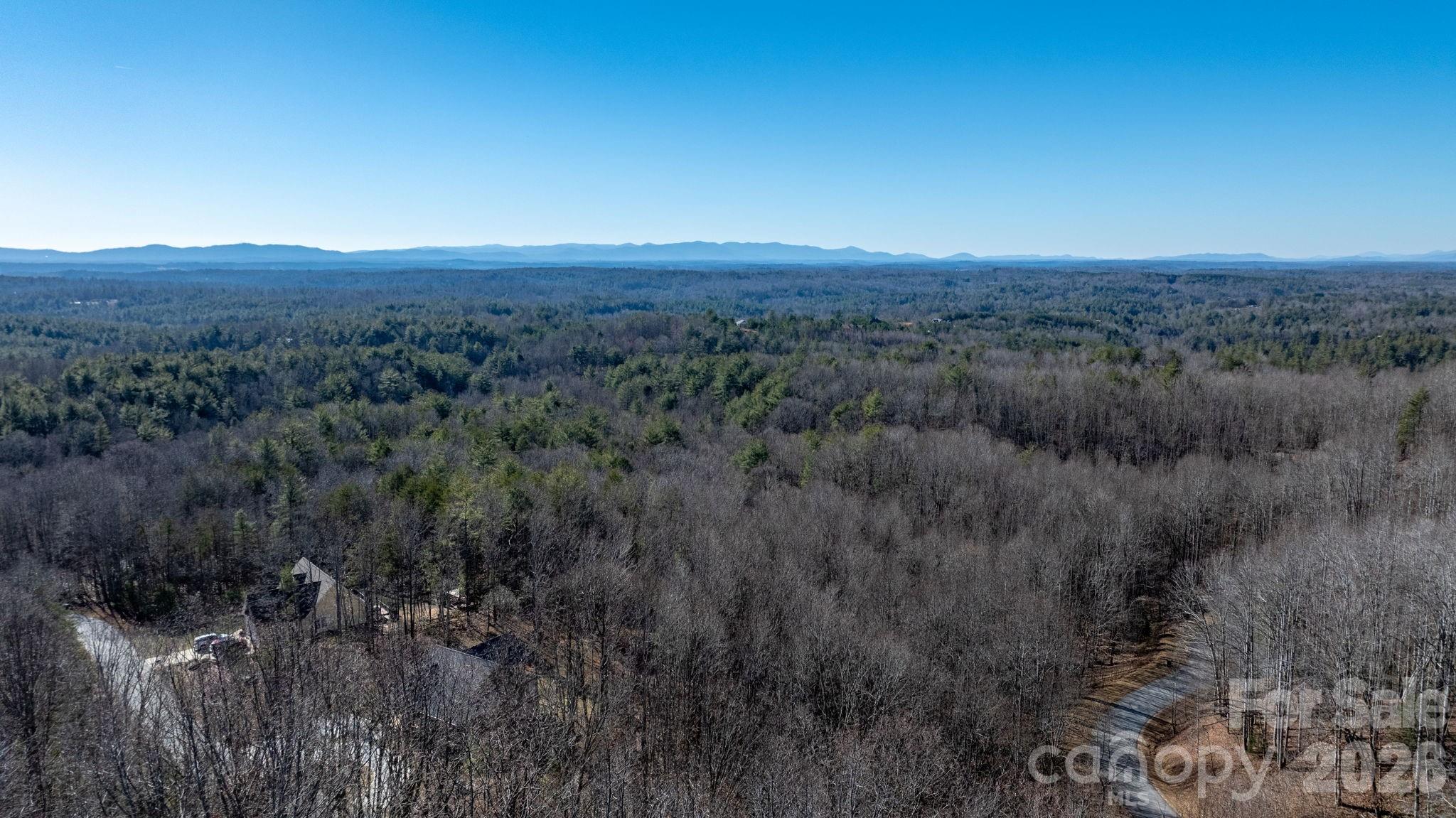 0 Round Rock Road Lenoir, NC 28645 - Photo 23 of 26 a view of a city with lush green forest
