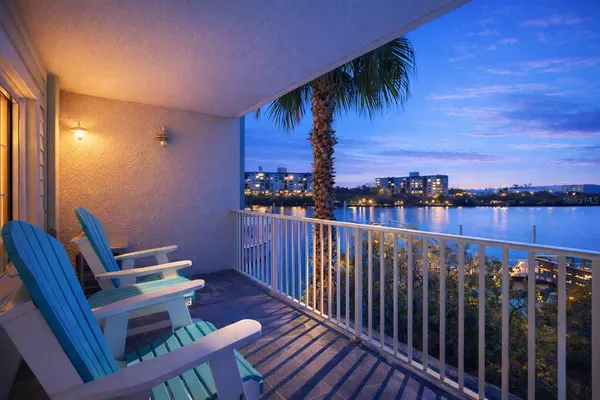 a view of a balcony with furniture