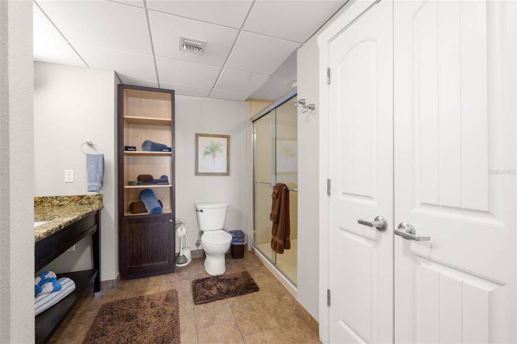 399 2nd Street, Unit 216 Indian Rocks Beach, FL 33785 - Photo 12 of 45 a bathroom with a sink toilet and shower