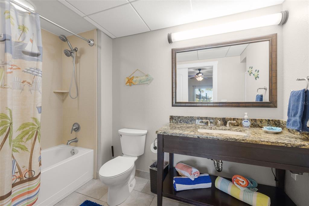 399 2nd Street, Unit 216 Indian Rocks Beach, FL 33785 - Photo 13 of 45 a bathroom with a sink toilet and shower