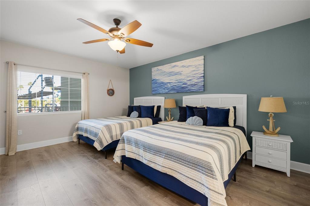 399 2nd Street, Unit 216 Indian Rocks Beach, FL 33785 - Photo 14 of 45 a bedroom with two beds and a window