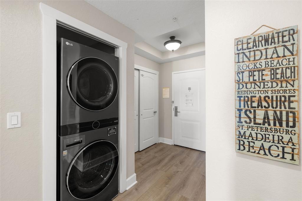 399 2nd Street, Unit 216 Indian Rocks Beach, FL 33785 - Photo 19 of 45 a view of a hallway with washer and dryer