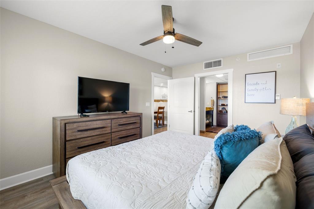 399 2nd Street, Unit 216 Indian Rocks Beach, FL 33785 - Photo 26 of 45 a bedroom with a bed and a flat screen tv