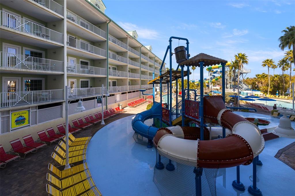 399 2nd Street, Unit 216 Indian Rocks Beach, FL 33785 - Photo 33 of 45 a front view of a house with outdoor seating