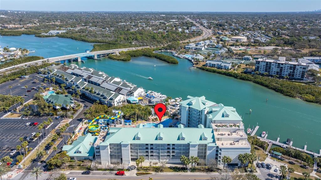 399 2nd Street, Unit 216 Indian Rocks Beach, FL 33785 - Photo 36 of 45 an aerial view of residential building and lake