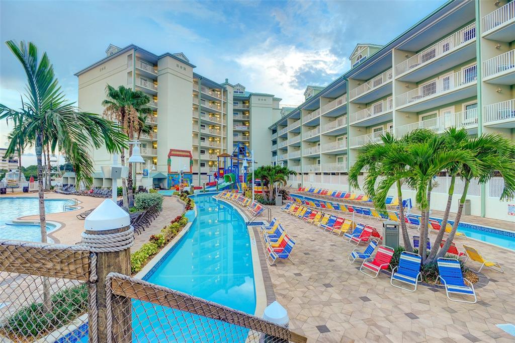 399 2nd Street, Unit 216 Indian Rocks Beach, FL 33785 - Photo 4 of 45 a view of multi story residential apartment building with entryway and outdoor space