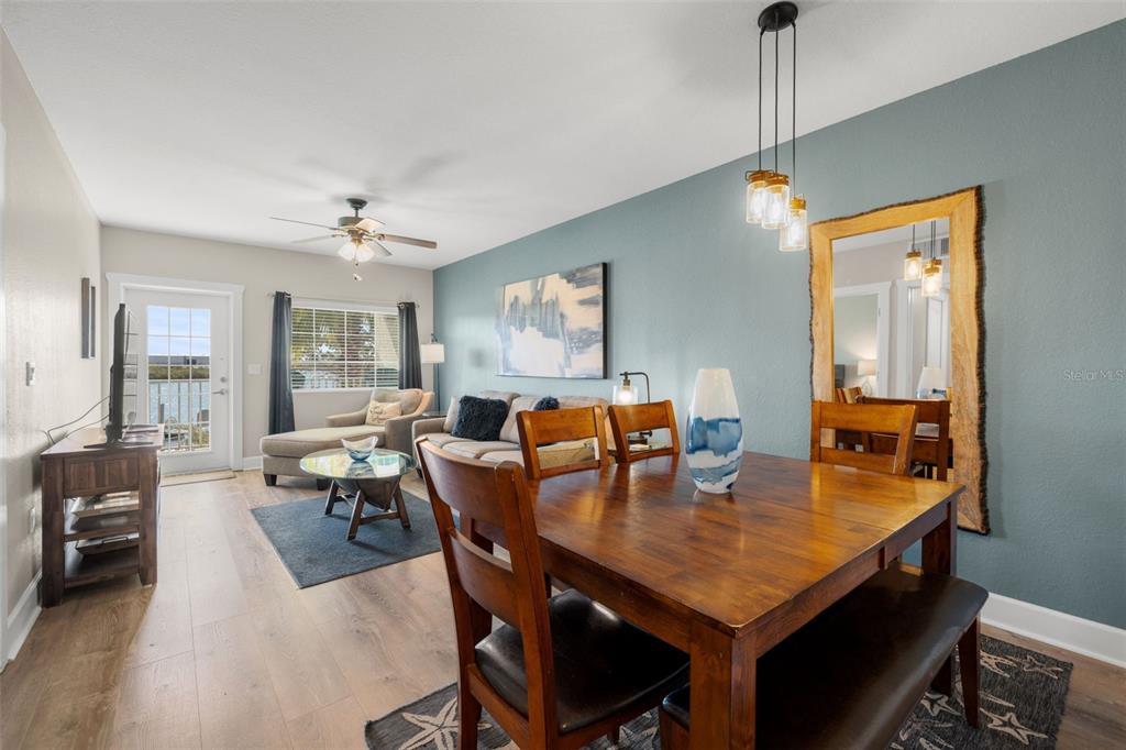 399 2nd Street, Unit 216 Indian Rocks Beach, FL 33785 - Photo 7 of 45 a view of a dining room with furniture and chandelier