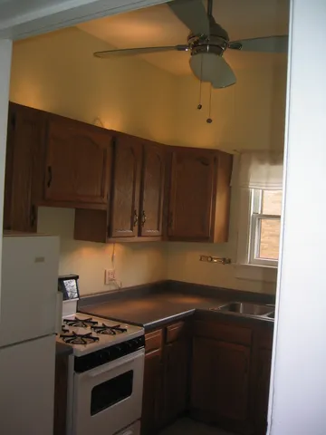 a kitchen with stainless steel appliances a stove and a microwave