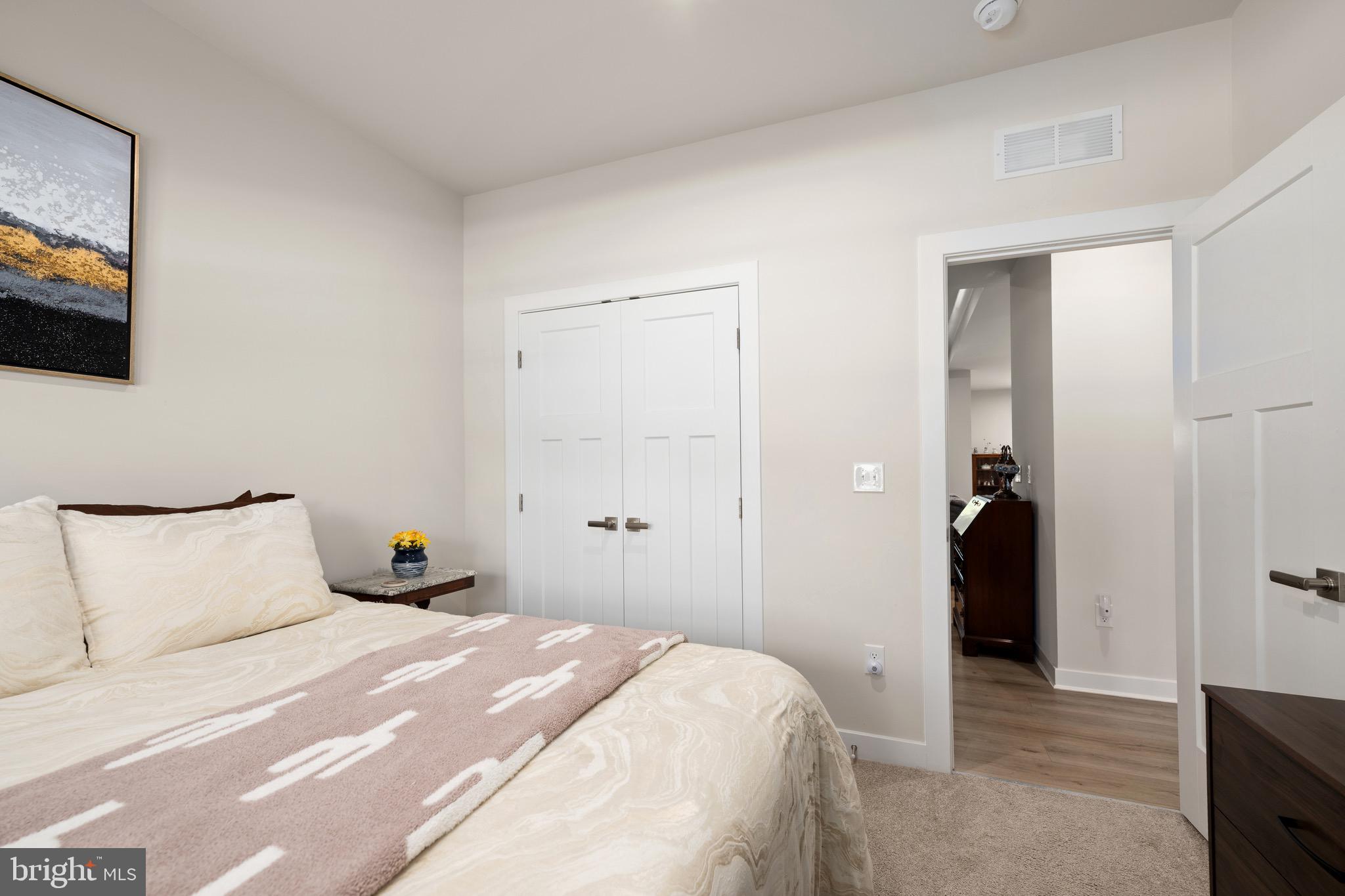 30478 Indigo Way Georgetown, DE 19947 - Photo 22 of 41 a bedroom with a bed and a flat screen tv