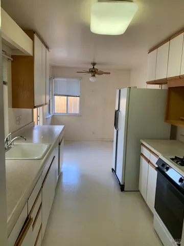 a view of a house with swimming pool and garden