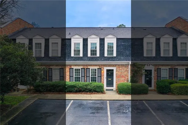 a front view of a building with garden