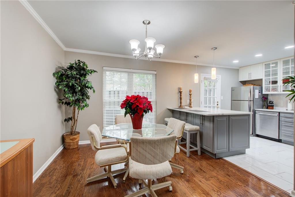 10 Market Square Place Northwest Atlanta, GA 30318 - Photo 11 of 36 a view of a dining room with furniture and a chandelier