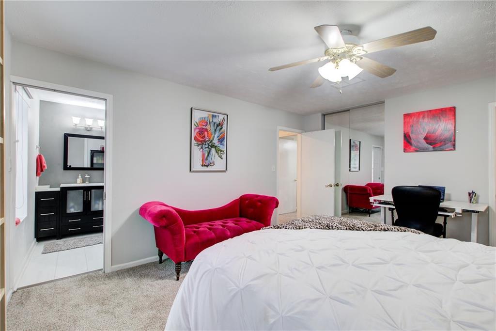 10 Market Square Place Northwest Atlanta, GA 30318 - Photo 23 of 36 a bedroom with bed and furniture