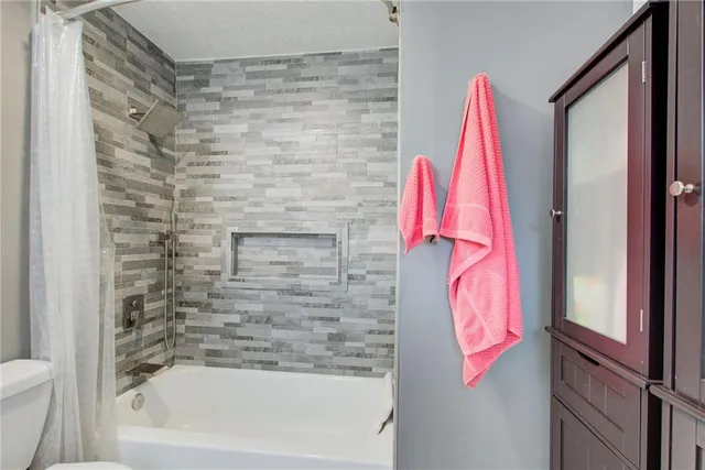 a bathroom with a sink vanity and a mirror