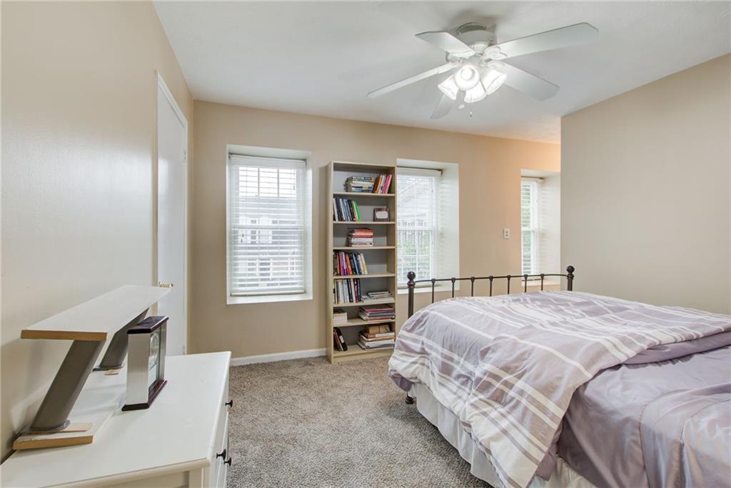 10 Market Square Place Northwest Atlanta, GA 30318 - Photo 27 of 36 a bedroom with a bed furniture and a window