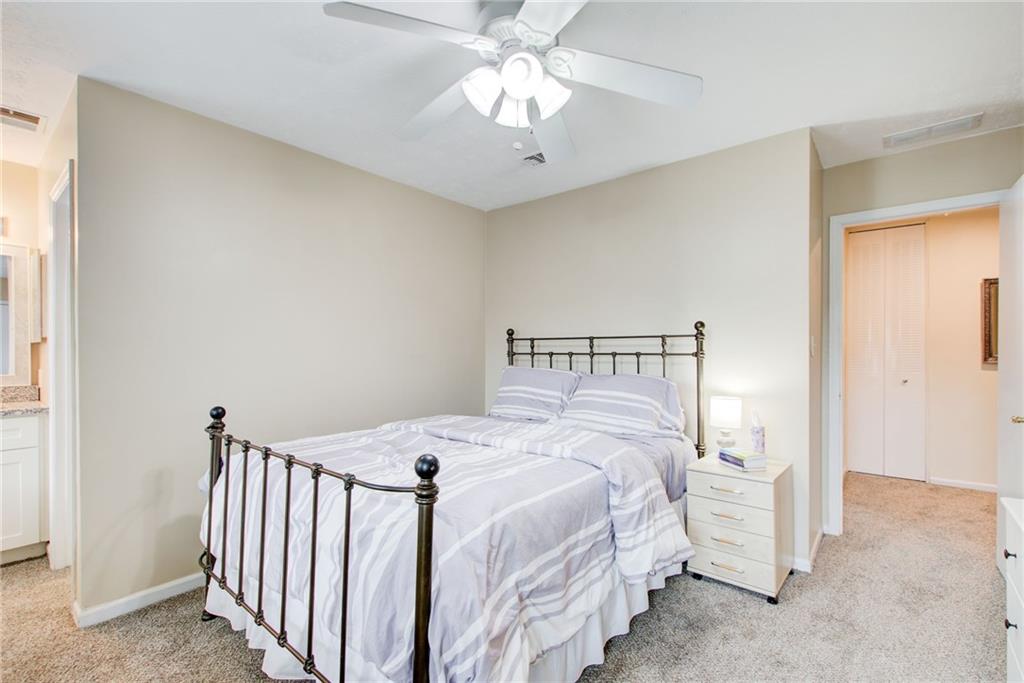 10 Market Square Place Northwest Atlanta, GA 30318 - Photo 31 of 36 a bedroom with a bed and a chandelier