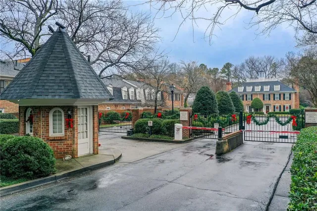 a front view of a brick house with a yard