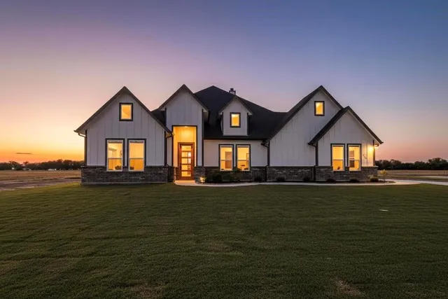 a front view of a house with swimming pool having outdoor seating