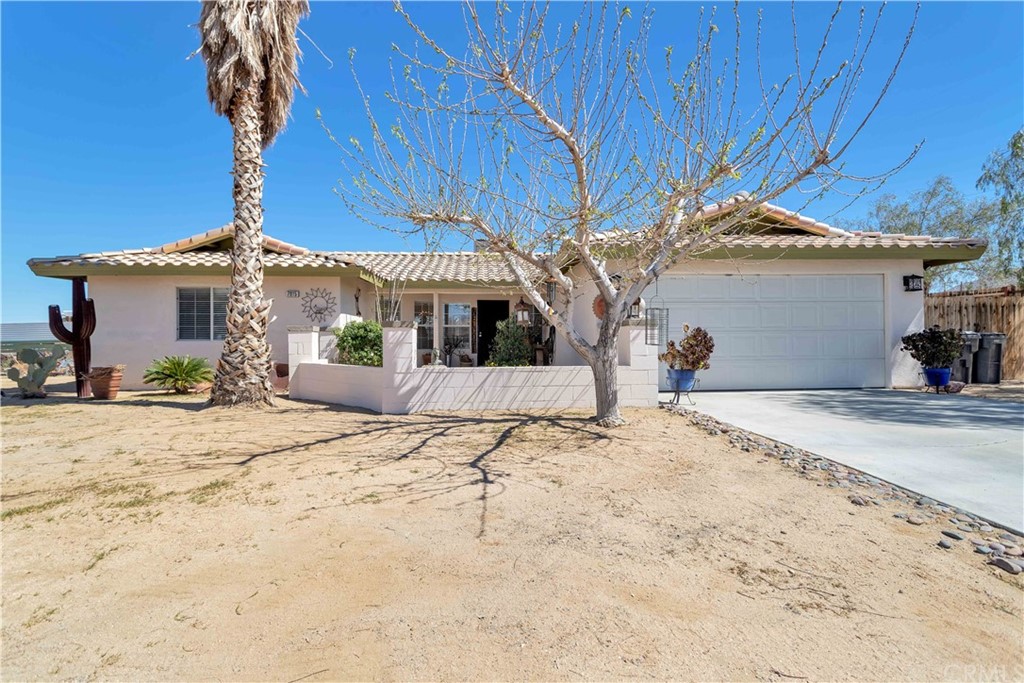 7015 Mecca Road Joshua Tree, CA 92252 - Photo 1 of 1 a view of a backyard