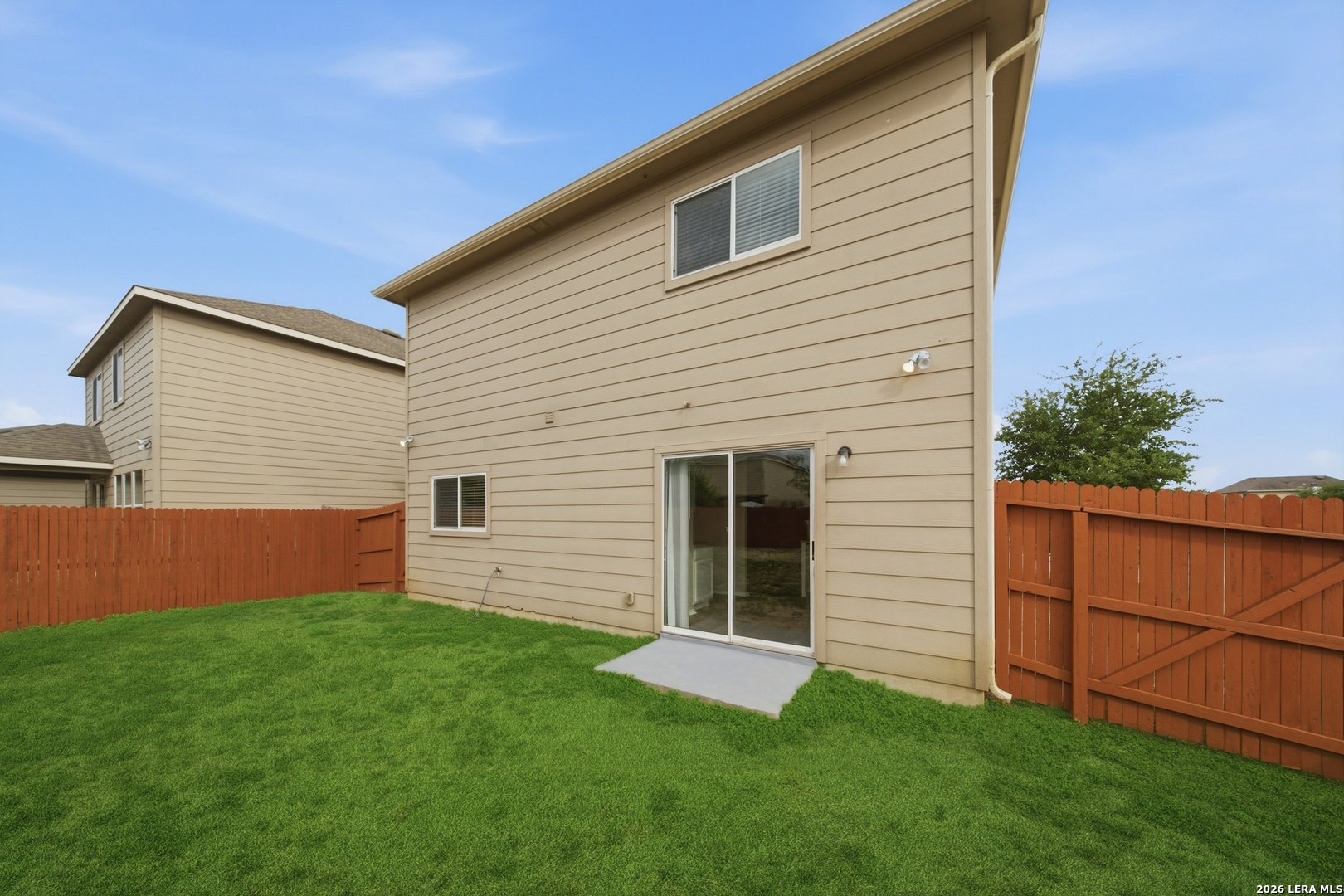 403 Walnut Crest Schertz, TX 78154 - Photo 27 of 30 a view of backyard with potted plants and wooden fence
