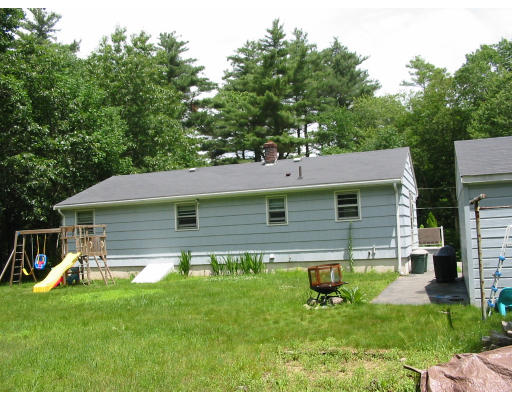 119 Prentice Road Northbridge, MA 01588 - Photo 8 of 9 a backyard of a house with table and chairs