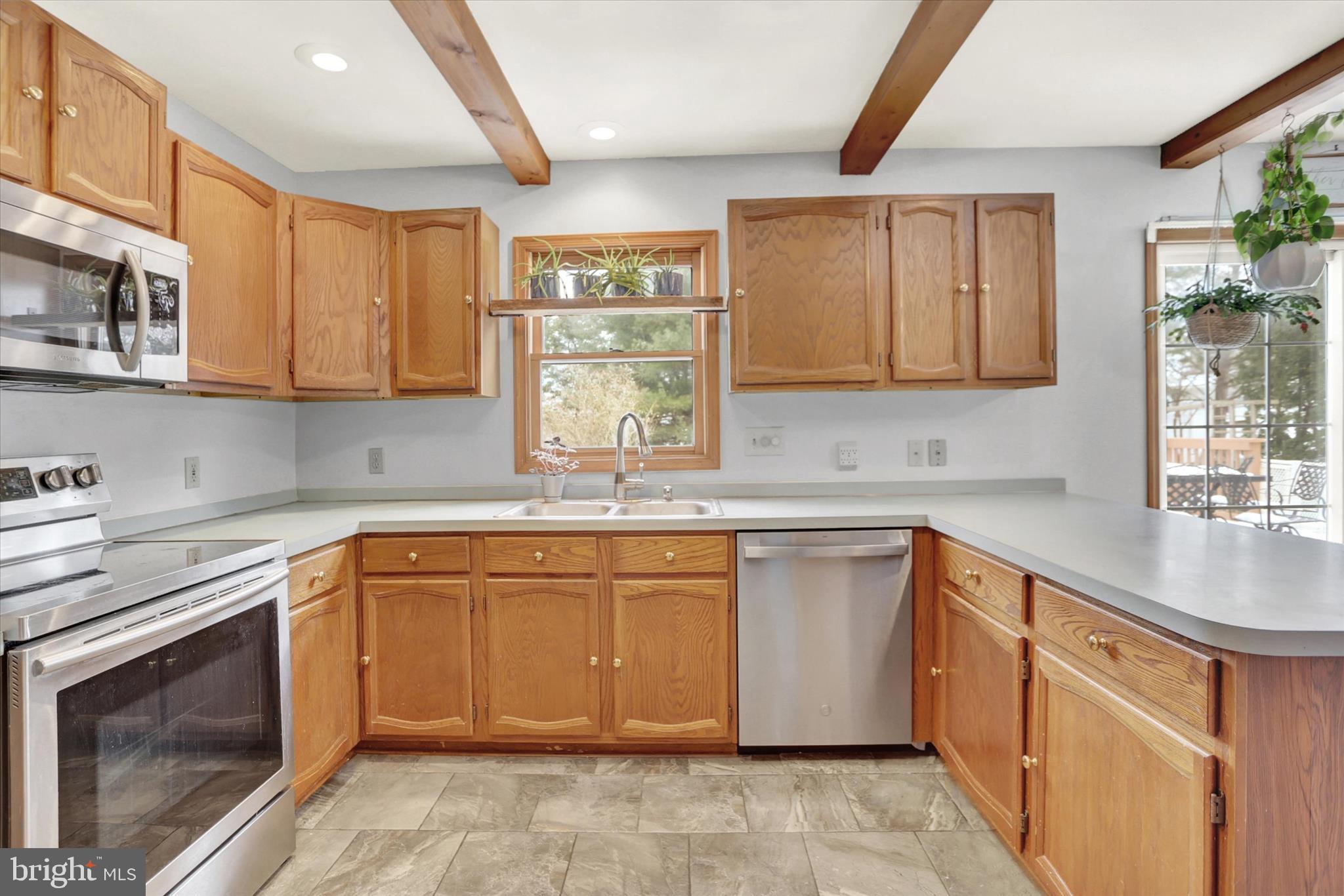405 Clover Road Etters, PA 17319 - Photo 12 of 50 a kitchen with stainless steel appliances granite countertop a stove sink and cabinets
