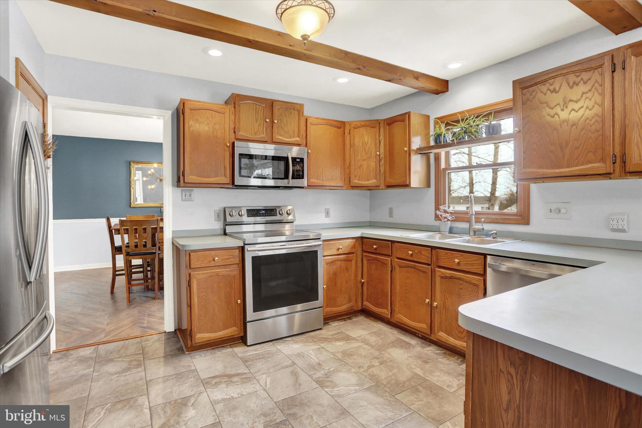 405 Clover Road Etters, PA 17319 - Photo 13 of 50 a kitchen with stainless steel appliances granite countertop a sink and cabinets