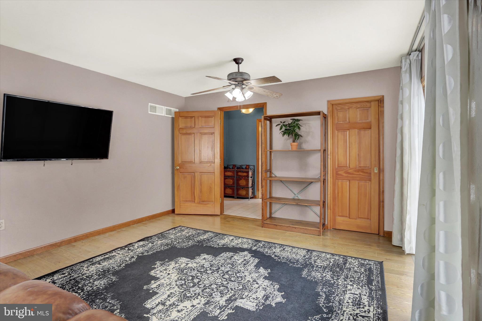 405 Clover Road Etters, PA 17319 - Photo 19 of 50 a living room with a flat screen tv and a fireplace
