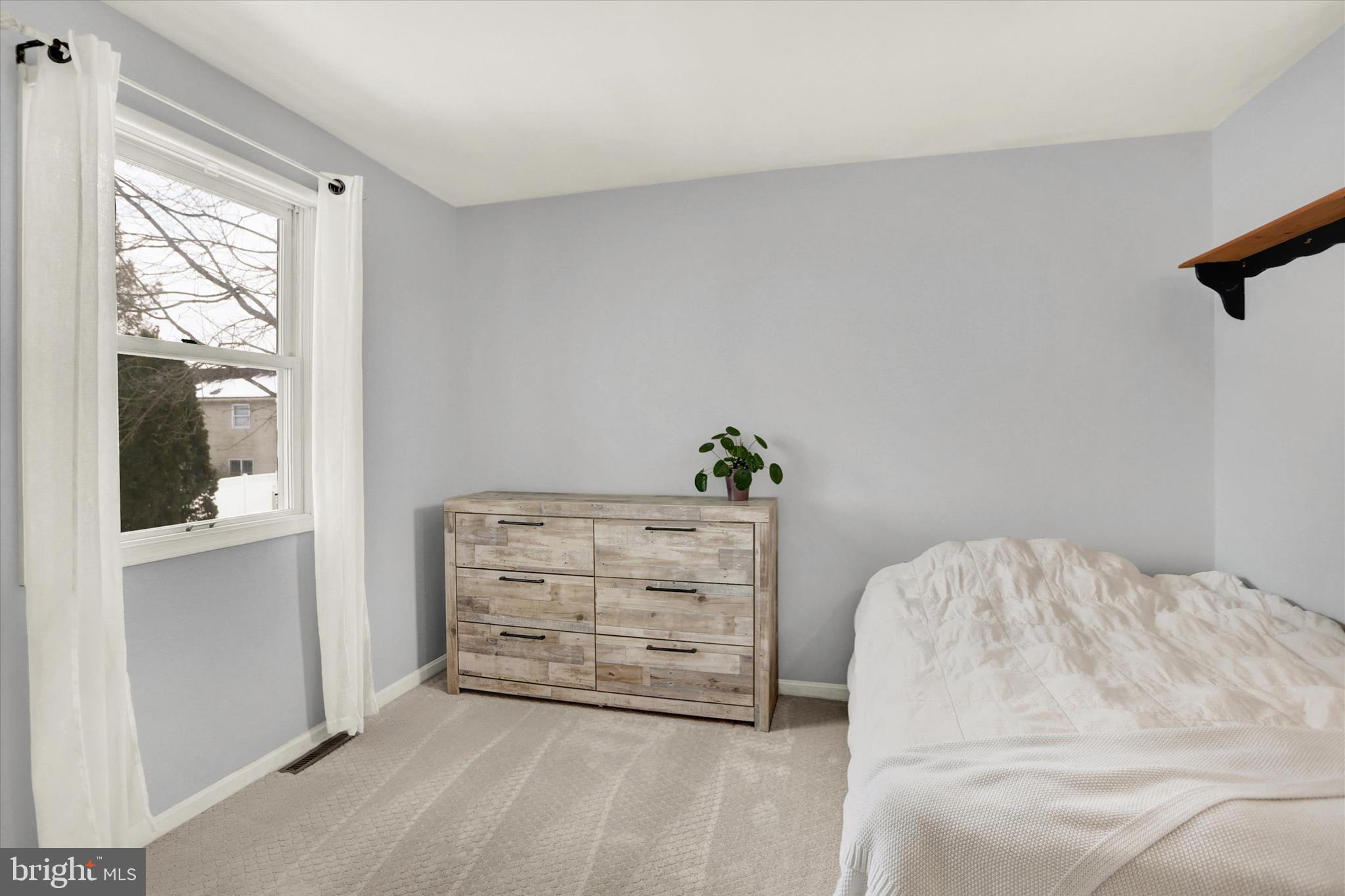 405 Clover Road Etters, PA 17319 - Photo 20 of 50 a bedroom with a bed and a window