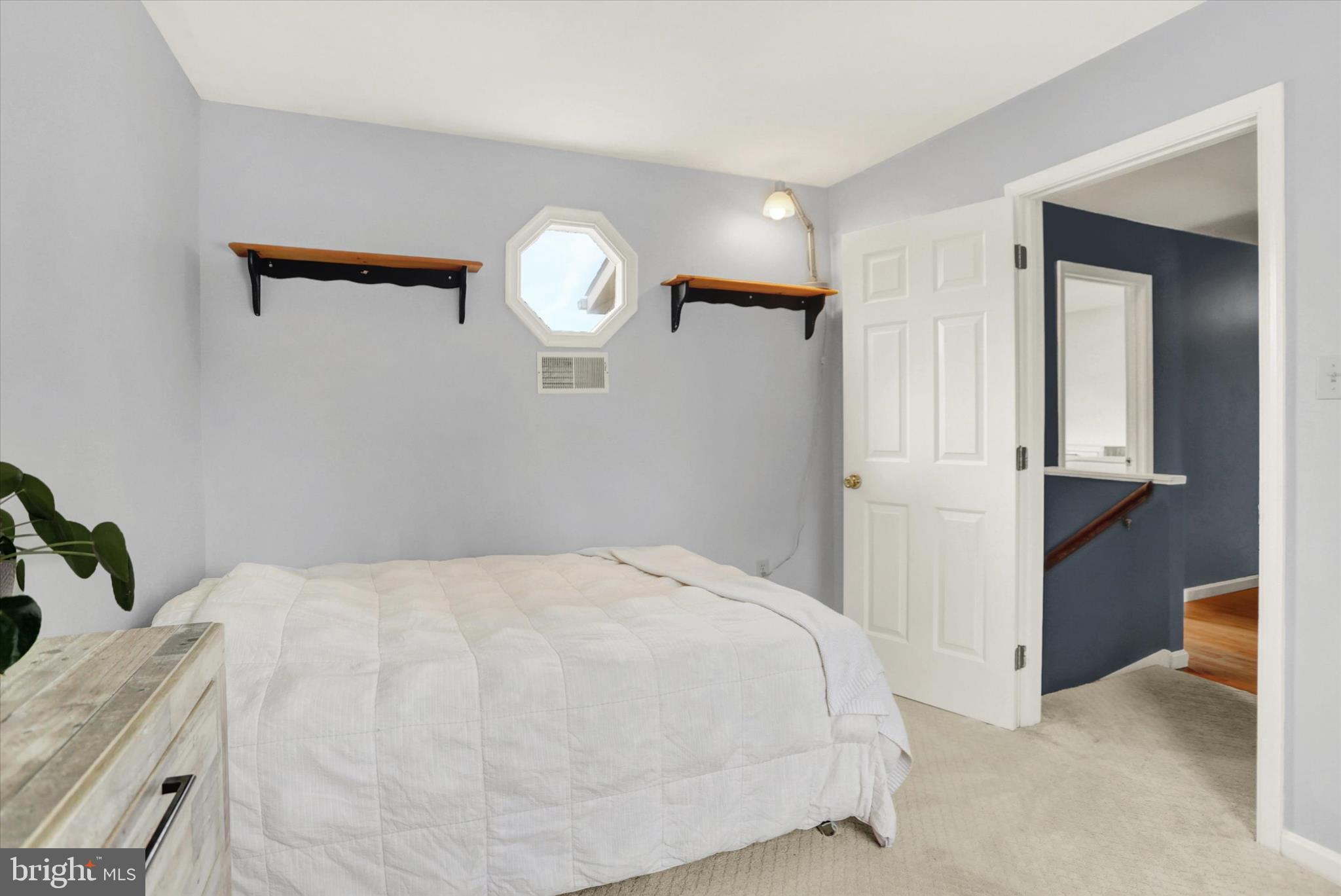 405 Clover Road Etters, PA 17319 - Photo 21 of 50 a bedroom with a bed and a chandelier