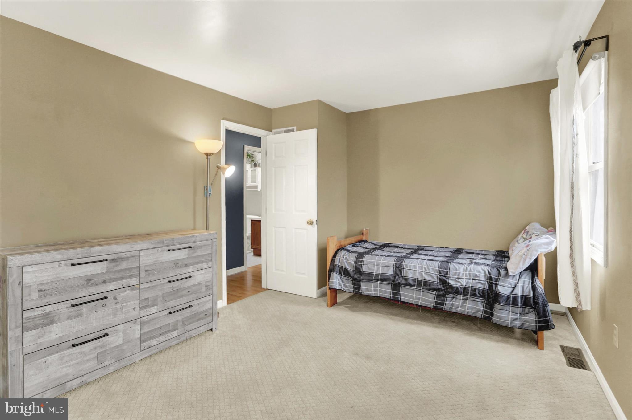 405 Clover Road Etters, PA 17319 - Photo 31 of 50 a room with a baby crib and dresser