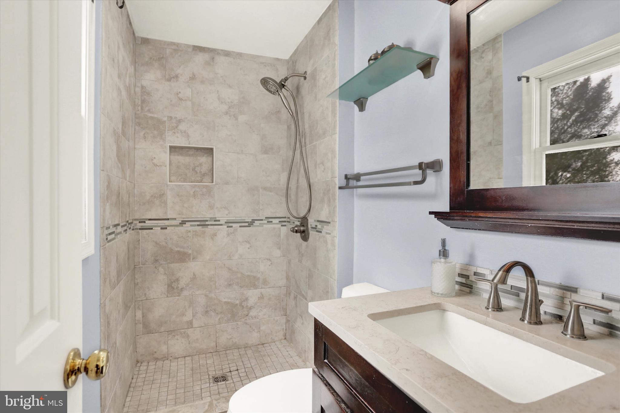 405 Clover Road Etters, PA 17319 - Photo 32 of 50 a bathroom with a sink vanity granite toilet and shower