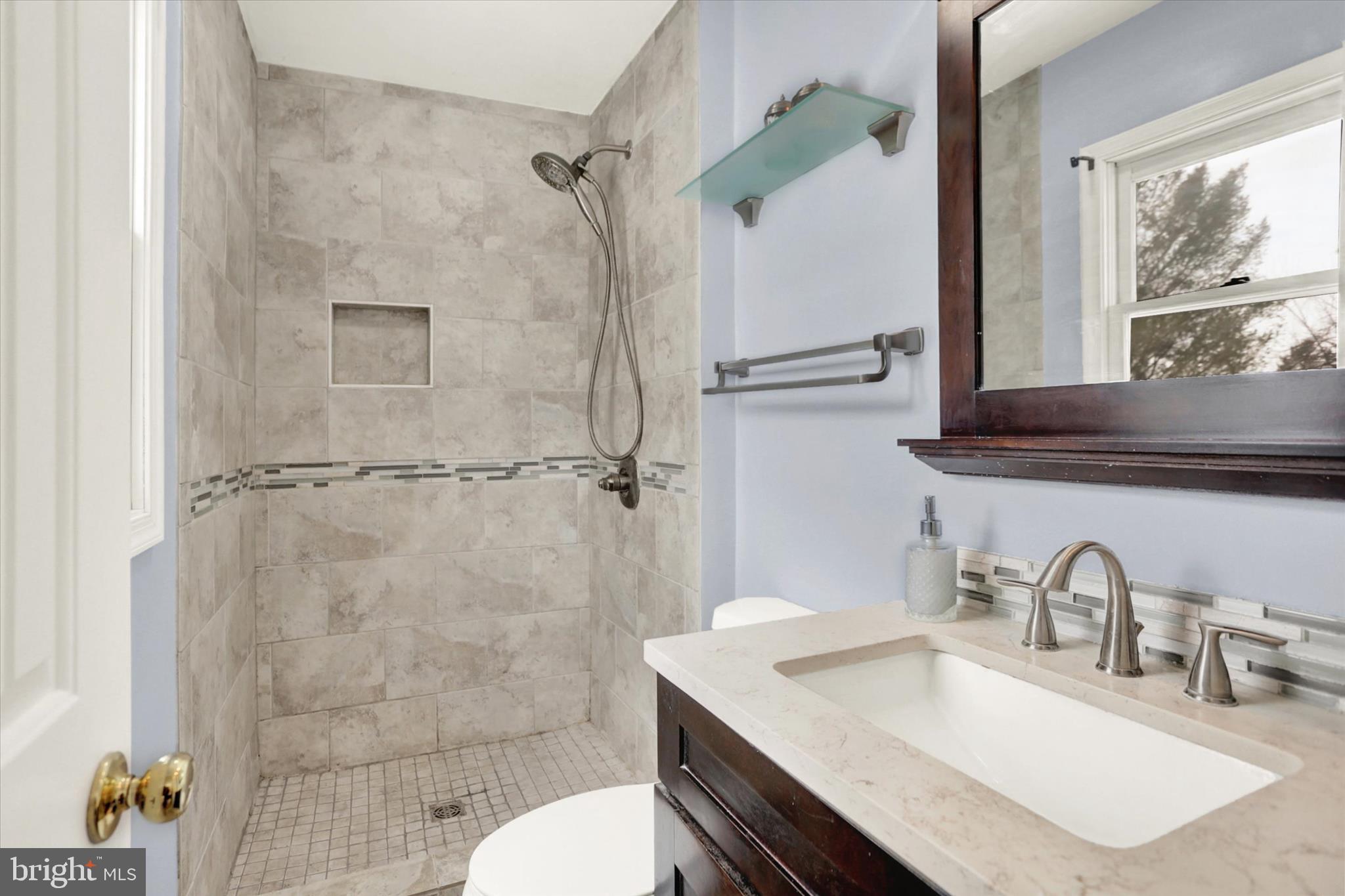 405 Clover Road Etters, PA 17319 - Photo 33 of 50 a bathroom with a sink toilet a mirror and shower