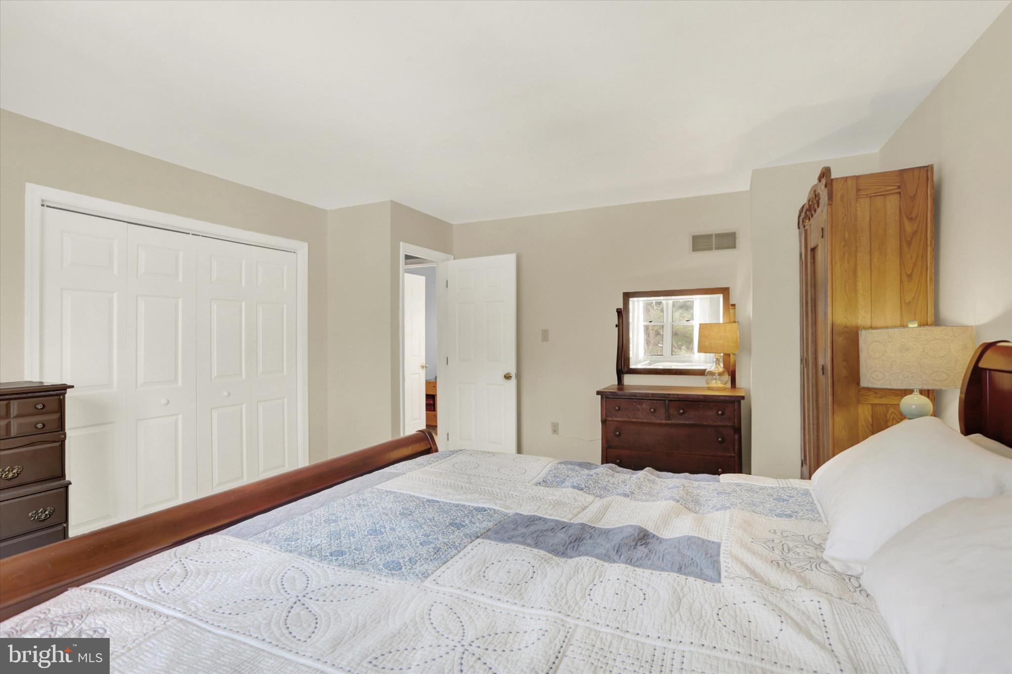 405 Clover Road Etters, PA 17319 - Photo 34 of 50 a bedroom with a bed and wooden floor