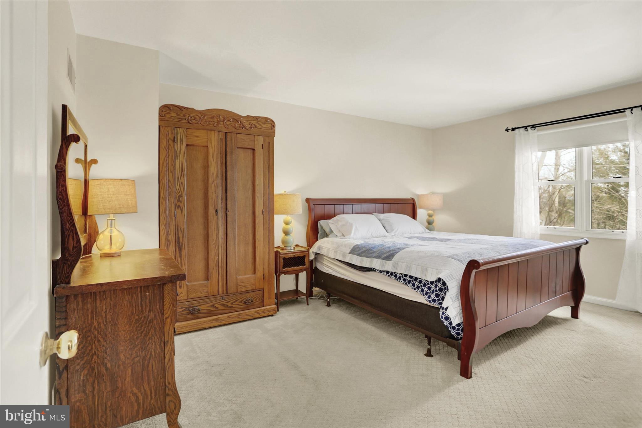 405 Clover Road Etters, PA 17319 - Photo 36 of 50 a bedroom with a bed closet and mirror