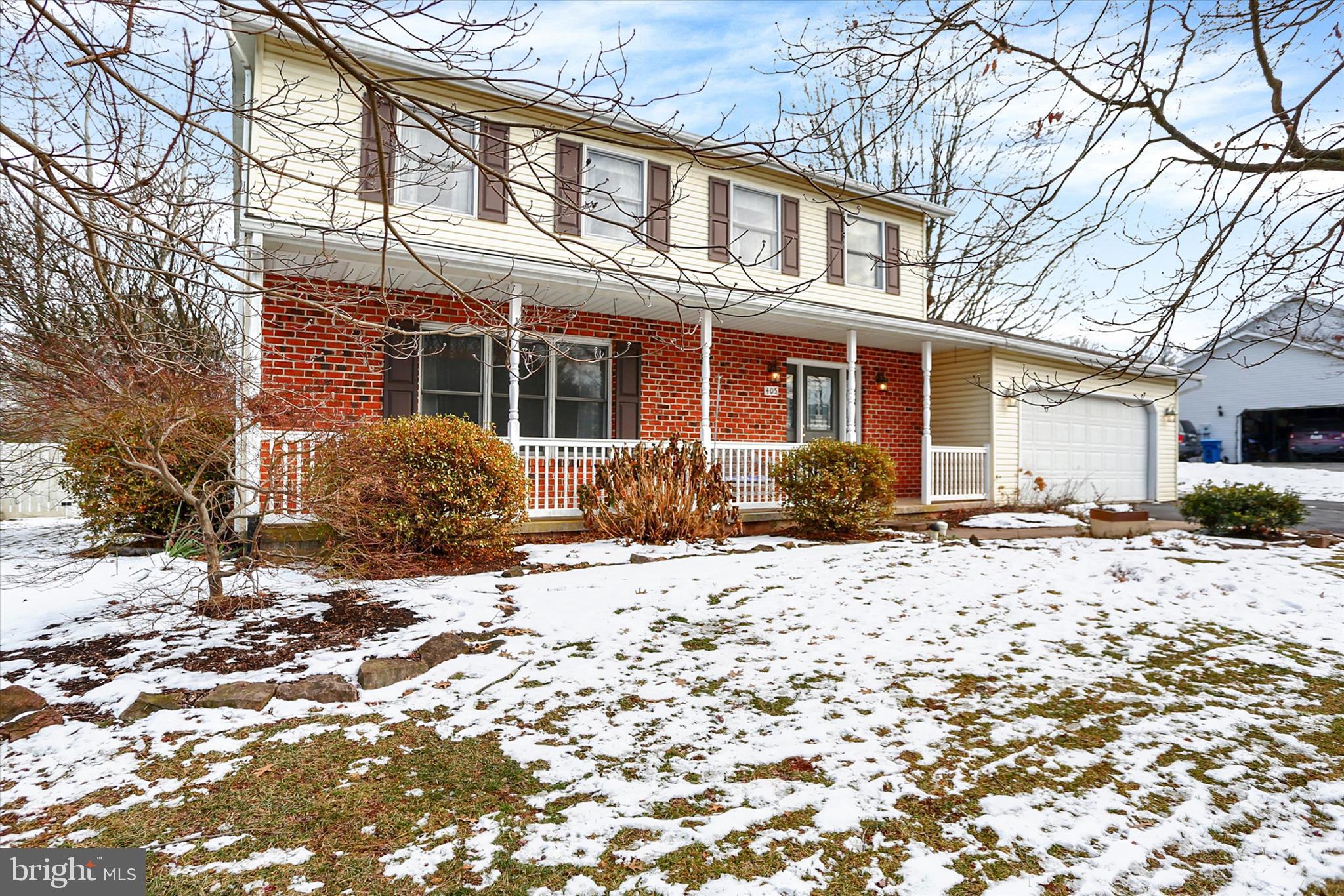 405 Clover Road Etters, PA 17319 - Photo 4 of 50 a front view of a house with a yard covered in snow