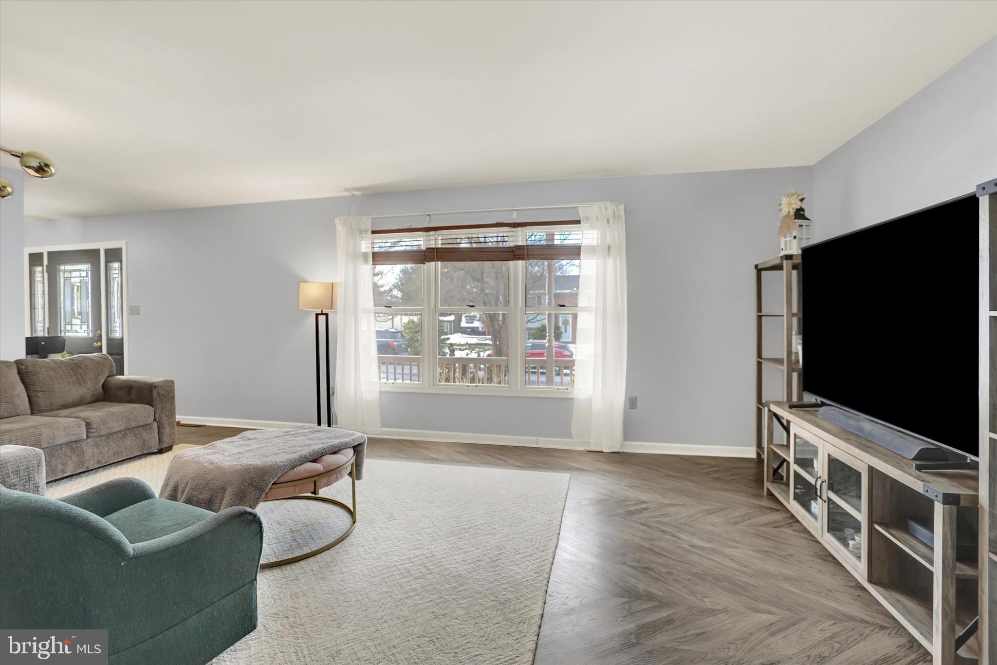 405 Clover Road Etters, PA 17319 - Photo 8 of 50 a living room with furniture and a flat screen tv